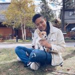 Photo of Karl Chen with a dog